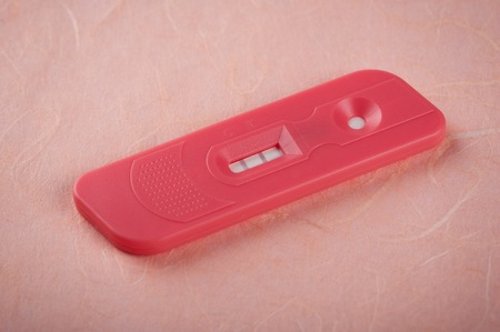 closeup pregnancy test with positive pregnantの写真素材