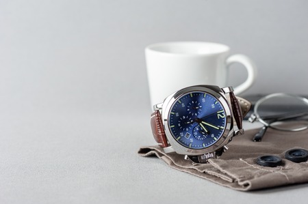 luxury fashion watch with blue dial and brown crocodile grain leather watch bandの写真素材