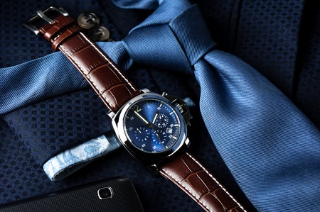 luxury fashion watch with blue dial and brown crocodile grain leather watch bandの写真素材