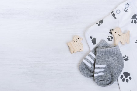 new baby socks on white wooden board, newborn and baby conceptの写真素材