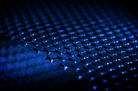 abstract dark background from mesh plastic net, shallow depth of fild