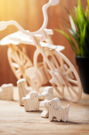 cute wooden toy animal on wood board, tiny toys and shallow depth of fieldの写真素材