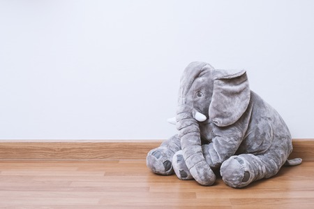 cute fluffy elephant doll isolated on the floorの写真素材