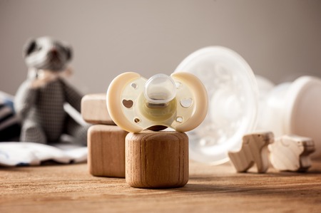 closeup new yellow baby pacifier, silicone nipple. Pacifier also call dummy or binky or soother or teether. Childcare concept.の写真素材