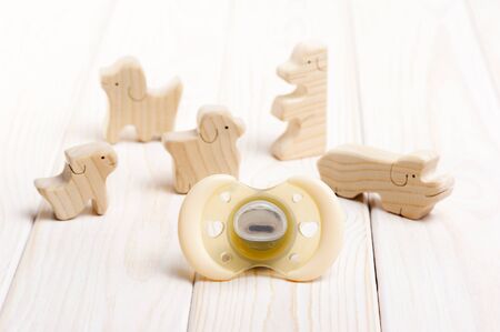 closeup new yellow baby pacifier, silicone nipple. Pacifier also call dummy or binky or soother or...