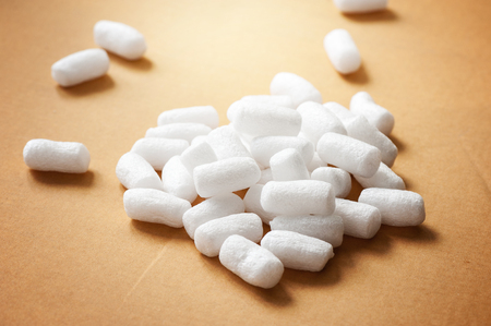 Closeup white polystyrene foam on the cardboard. Polystyrene foam is cushioning material in packaging, material for craft applications and other.の写真素材