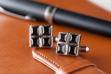 closeup shiny cufflinks with gemstones, accessory for menの写真素材
