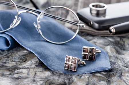 closeup shiny cufflinks with gemstones, accessory for menの写真素材
