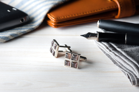 closeup shiny cufflinks with gemstones, accessory for menの写真素材