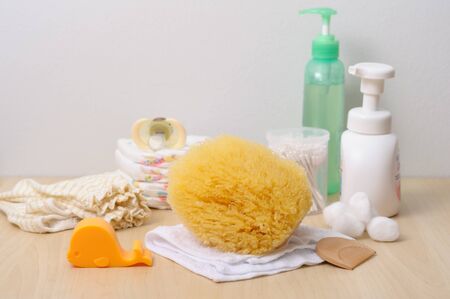 baby bathing concept, closeup at natural sea sponge (bath sponge)の写真素材