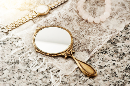 vintage style of women hand mirror, women gadget, beauty conceptの写真素材