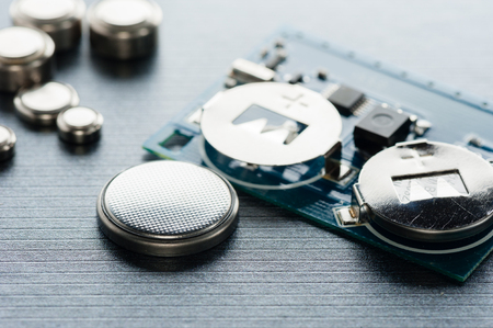 closeup button cell battery or watch battery or coin cell, used to power small electronics devices such as wrist watches or computer motherboard.の写真素材