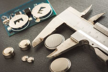closeup button cell battery or watch battery or coin cell, used to power small electronics devices...