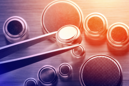 closeup button cell battery or watch battery or coin cell, used to power small electronics devices such as wrist watches or computer motherboard.の写真素材