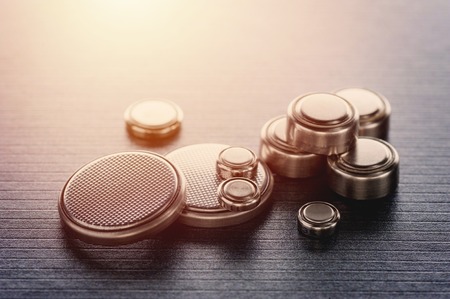 closeup button cell battery or watch battery or coin cell, used to power small electronics devices such as wrist watches or computer motherboard.の写真素材