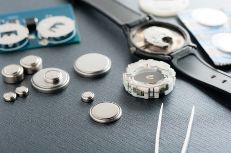 closeup button cell battery or watch battery or coin cell, used to power small electronics devices such as wrist watches or computer motherboard.の写真素材