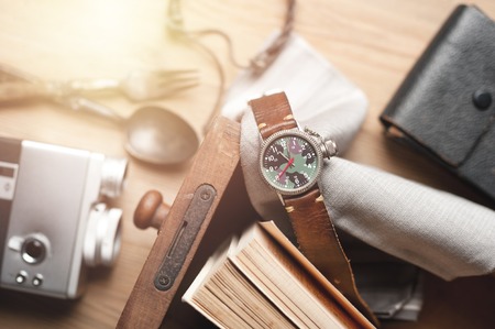 old military or field style of wristwatch with camouflage dial and leather band.の写真素材