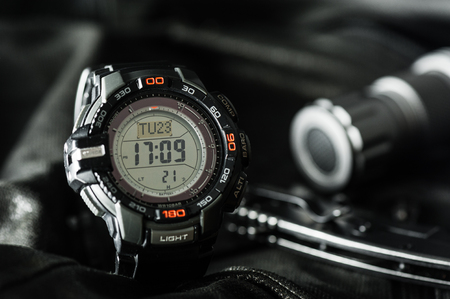 Black digital watch for outdoor activities with stopwatch feature, countdown timer, backlight and water resistance.の写真素材