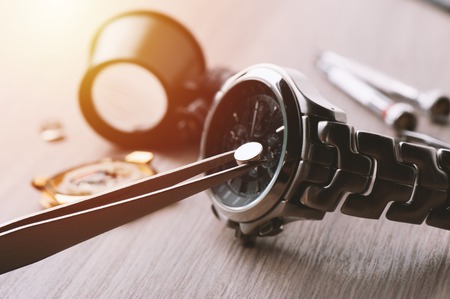 watch battery replacement, watchmaker replacing watch battery on quartz watchの写真素材