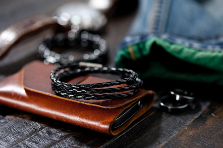 closeup black braided leather bracelet for men, casual style of men accessories. Shallow depth of field.の写真素材
