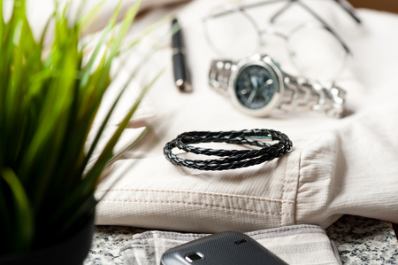closeup black braided leather bracelet for men, casual style of men accessories.の写真素材