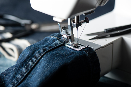indigo denim fabric with sewing equipments, garment industrial concept.の写真素材