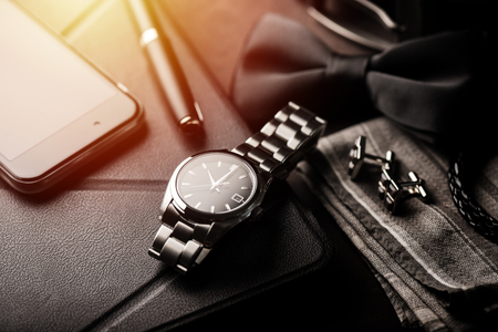 closeup luxury automatic wristwatch for men with black dial and stainless steel bracelet.の写真素材