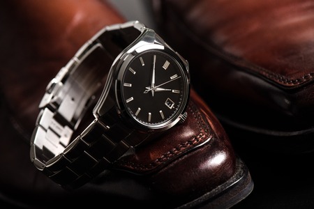 closeup luxury automatic wristwatch for men with black dial and stainless steel bracelet.の写真素材