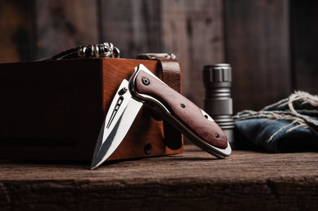 stainless steel folding knife with wooden handle and other everyday carry (EDC) items for men....