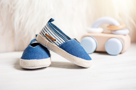 little blue shoes for baby with toys, baby clothing, baby accessoriesの写真素材
