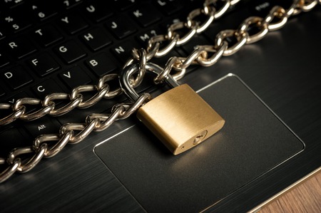 important information locked with chain and padlock, computer and data security concept.