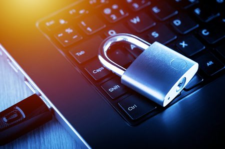 locked padlock on the laptop's keyboard, computer and data security concept.の写真素材