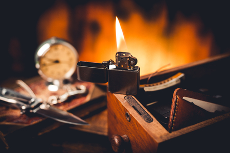 Brushed chrome lighter with windproof burning in the dark.の写真素材