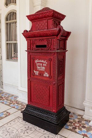 PHUKET, THAILAND - APRIL 19, 2018: Red vintage letter box in Phuket old town in Phuket province, Thailand.のeditorial素材