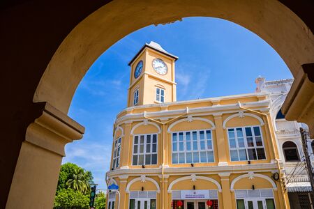 PHUKET, THAILAND - APRIL 19, 2018: Peranakannitat Museum building with clock tower at Phuket town in Phuket, Thailand.のeditorial素材