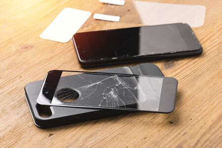 closeup broken tempered glass screen protector for smartphone.の写真素材