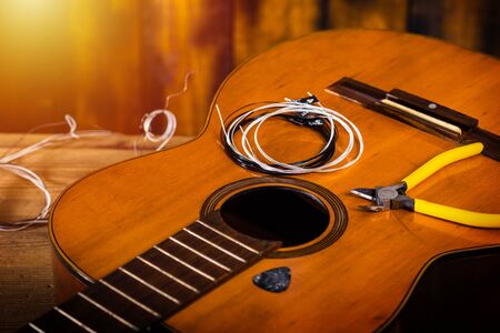Restring classical guitar concept. Closeup at the new strings.の写真素材