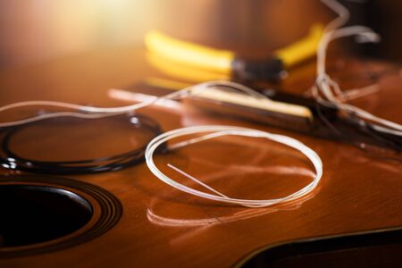 Restring classical guitar concept. Closeup at the new strings.の写真素材