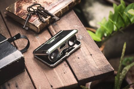 Closeup vintage folding opera glasses.