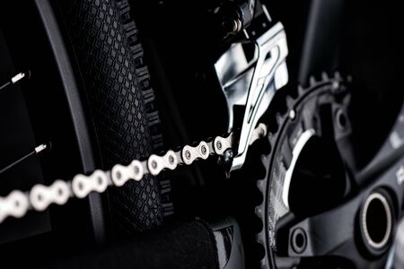 Closeup the chain on the moutain bike over black background.の写真素材