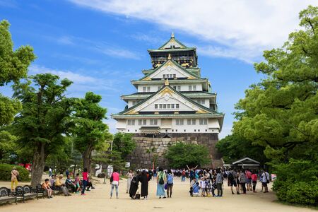 OSAKA, JAPAN - MAY 20, 2016: Tourists visiting the main tower of Osaka Castle in Osaka, Japan. The castle is one of Japan's most famous landmarks.のeditorial素材