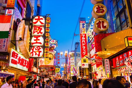 OSAKA, JAPAN - MAY 20, 2016: Many tourists walking in Dotonbori, the famous shopping street in Osaka, Japan.のeditorial素材