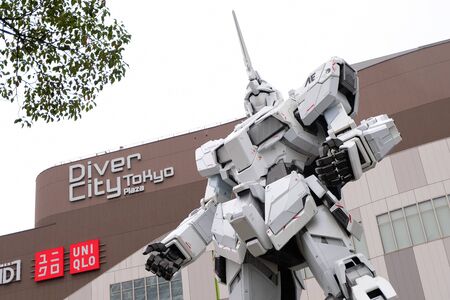 TOKYO, JAPAN - OCTOBER 23, 2018 : A life-sized RX-0 Unicorn Gundam statue on display outside DiverCity Tokyo Plaza in Odaiba, Tokyo. The Unicorn Gundam is anime robot in Gundam series.のeditorial素材