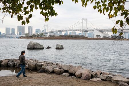 TOKYO, JAPAN - OCTOBER 23, 2018: Rainbow bridge in Odaiba, Tokyo. Rainbow bridge is a hinged two-tier bridge connecting Tokyo with the island of Odaiba.のeditorial素材