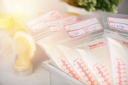 Breast milk frozen in plastic storage bags for baby. The way to store breast milk safely.
