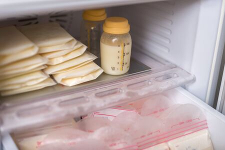 Breast milk frozen in plastic storage bags for baby. The way to store breast milk safely.の写真素材