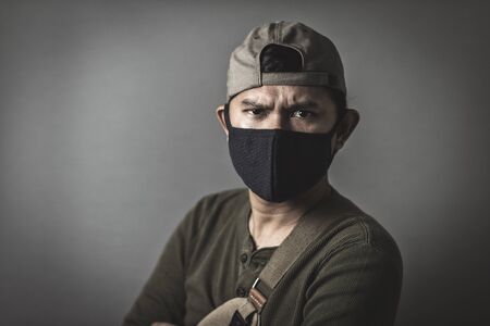 Portrait of asian man wearing cloth mask to against air pollution