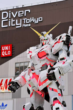 TOKYO, JAPAN - FEBRUARY 21, 2019 : A life-sized RX-0 Unicorn Gundam statue on display outside DiverCity Tokyo Plaza in Odaiba, Tokyo. The Unicorn Gundam is anime robot in Gundam series.のeditorial素材