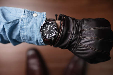 The man looking the time on his watch.の写真素材