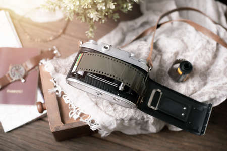 Closeup film in vintage camera on wooden desk.の写真素材